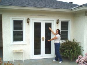 Homeowners with new French Swinging Patio Doors