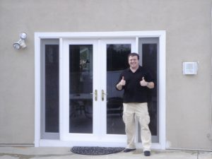 Homeowner with new French Swinging Patio Doors